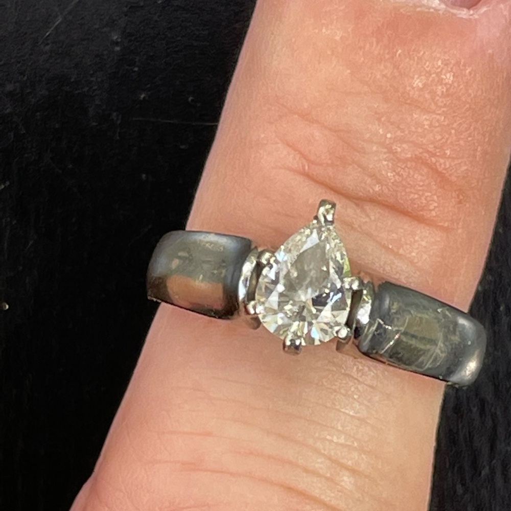 0.6 carat pear solitaire in white gold cathedral setting